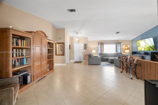 13317 NW 8th Ct, Sunrise, FL 33325 - living room with lofted ceiling, light tile patterned floors, and baseboards
