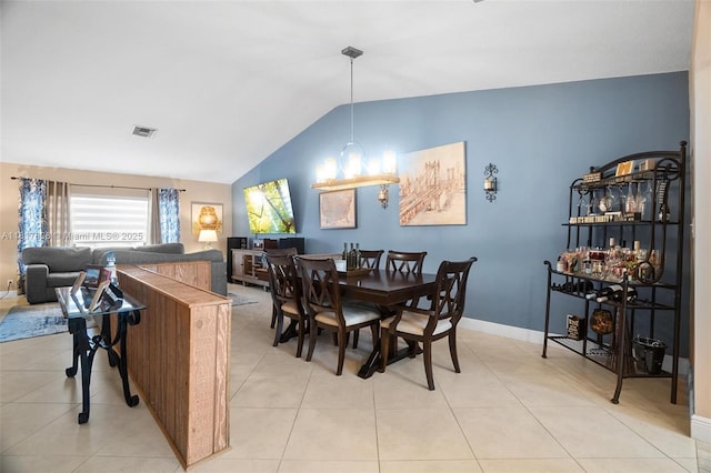 13317 NW 8th Ct, Sunrise, FL 33325 - dining space with lofted ceiling, baseboards, and light tile patterned floors