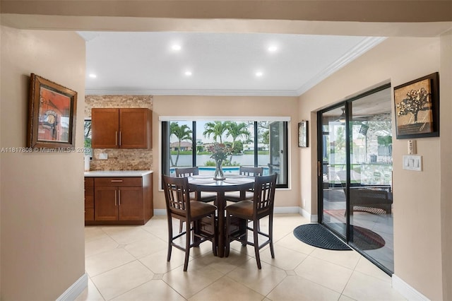 13317 NW 8th Ct, Sunrise, FL 33325 - dining room with crown molding, plenty of natural light, recessed lighting, baseboards, and light tile patterned floors
