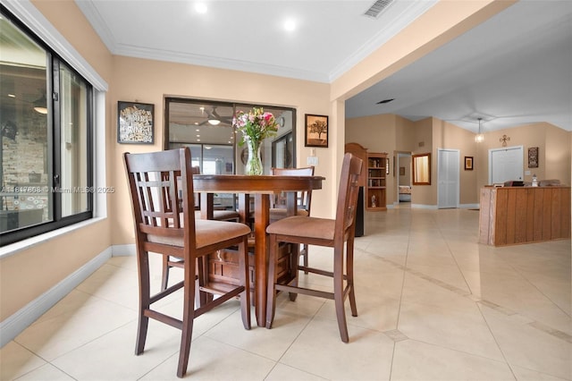 13317 NW 8th Ct, Sunrise, FL 33325 - dining space with light tile patterned floors, baseboards, and crown molding