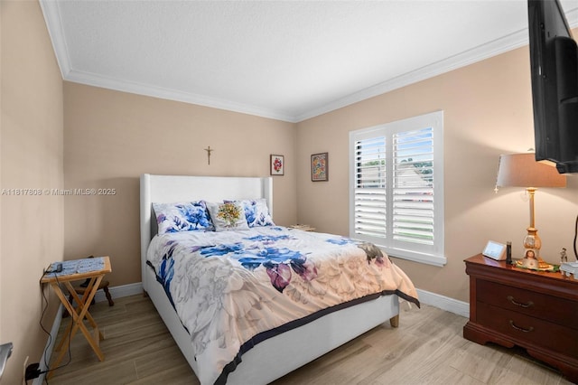 13317 NW 8th Ct, Sunrise, FL 33325 - bedroom with light wood-style flooring, ornamental molding, and baseboards