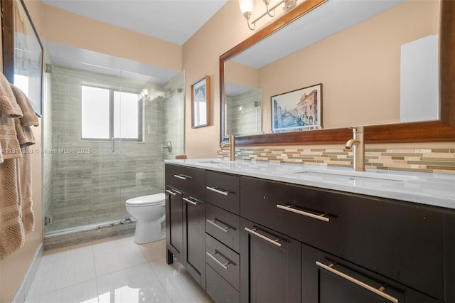 13317 NW 8th Ct, Sunrise, FL 33325 - full bathroom with double vanity, toilet, a shower stall, tile patterned flooring, and decorative backsplash