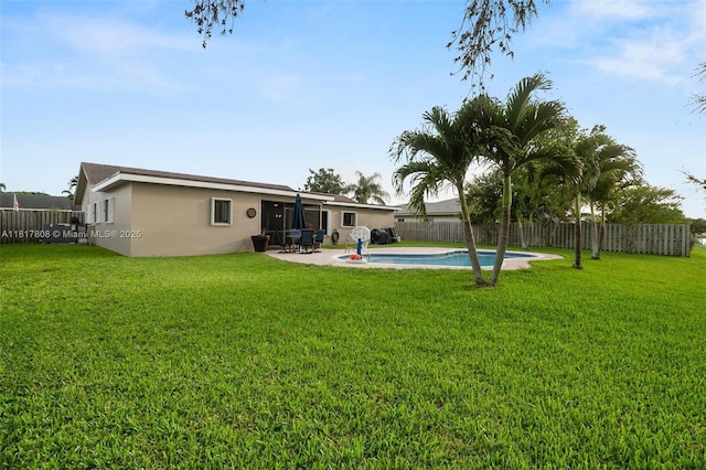 13317 NW 8th Ct, Sunrise, FL 33325 - rear view of house with stucco siding and a patio area