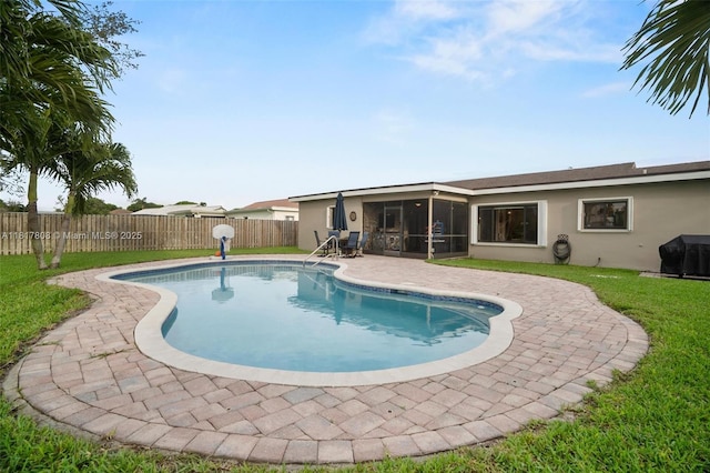 13317 NW 8th Ct, Sunrise, FL 33325 - view of pool featuring a sunroom, a patio, and area for grilling