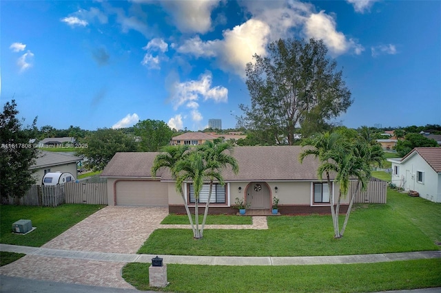 13317 NW 8th Ct, Sunrise, FL 33325 - view of front of home featuring decorative driveway, an attached garage, and roof with shingles