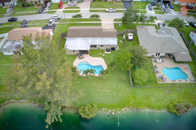 13317 NW 8th Ct, Sunrise, FL 33325 - aerial view of residential area with a pool and a nearby body of water
