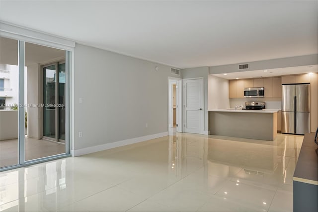 1150 101st St Unit 303, Bay Harbor Islands, FL 33154 - unfurnished living room featuring light tile patterned floors and baseboards