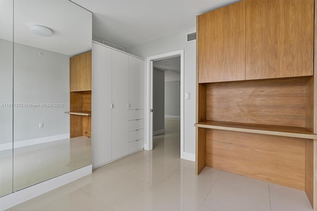 1150 101st St Unit 303, Bay Harbor Islands, FL 33154 - walk in closet featuring light tile patterned floors