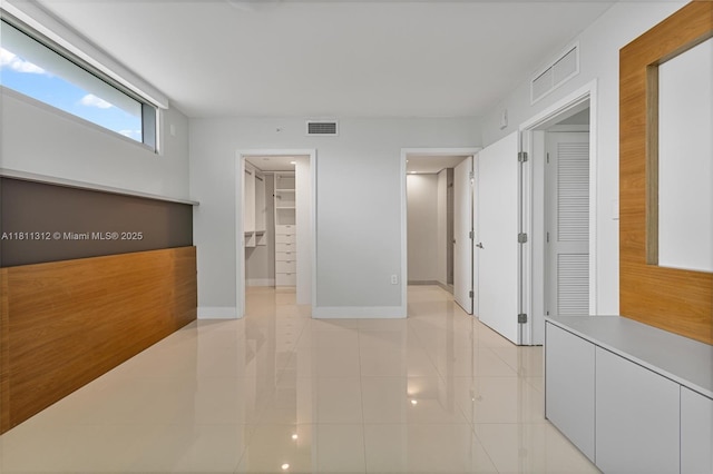 1150 101st St Unit 303, Bay Harbor Islands, FL 33154 - hall with baseboards and light tile patterned floors