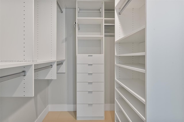 1150 101st St Unit 303, Bay Harbor Islands, FL 33154 - walk in closet featuring light tile patterned floors