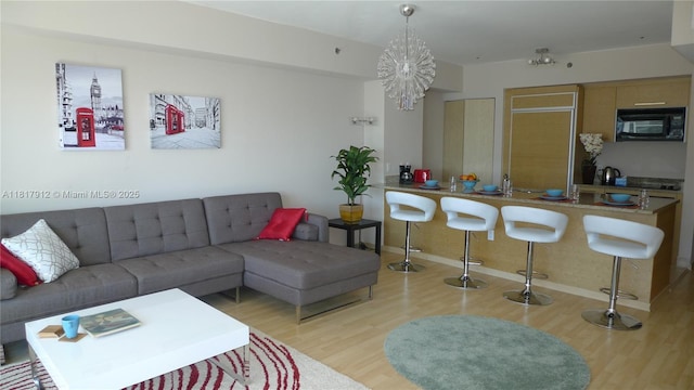 1830 S Ocean Dr Unit 1705, Hallandale Beach, FL 33009 - living room featuring wood finished floors, a chandelier, and baseboards