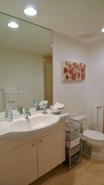 1830 S Ocean Dr Unit 1705, Hallandale Beach, FL 33009 - bathroom featuring vanity, tile patterned floors, toilet, a shower with shower door, and recessed lighting