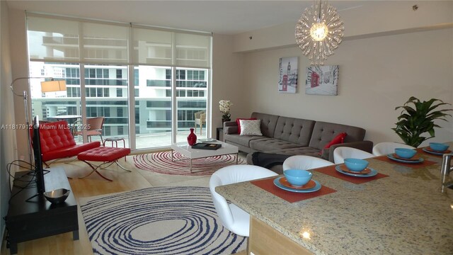 1830 S Ocean Dr Unit 1705, Hallandale Beach, FL 33009 - living area with wood finished floors and a chandelier