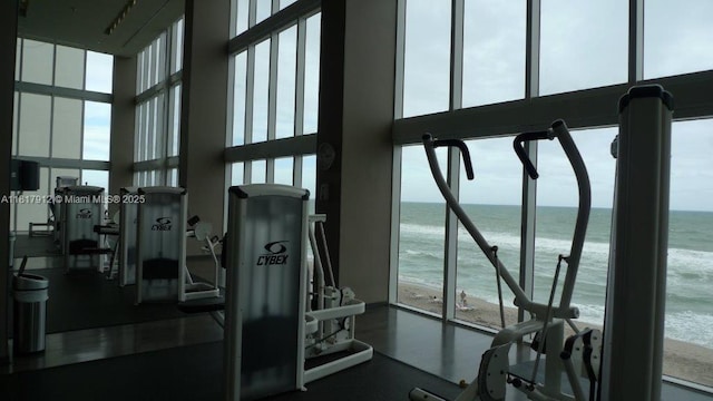 1830 S Ocean Dr Unit 1705, Hallandale Beach, FL 33009 - gym with a towering ceiling, view of water and beach, and plenty of natural light