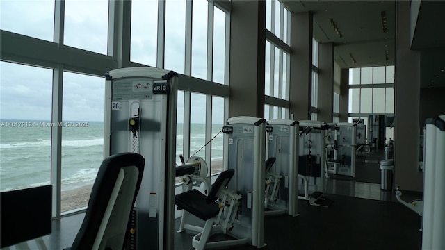 1830 S Ocean Dr Unit 1705, Hallandale Beach, FL 33009 - workout area with a high ceiling, view of water and beach, and plenty of natural light