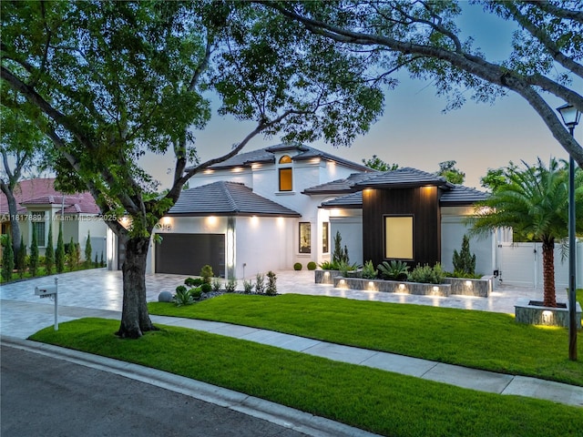 3461 SW 145th Ave, Miramar, FL 33027 - view of front of house featuring driveway, an attached garage, a tile roof, and stucco siding