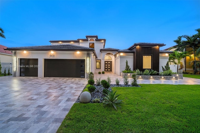 3461 SW 145th Ave, Miramar, FL 33027 - prairie-style house with an attached garage, a front lawn, a tiled roof, and decorative driveway