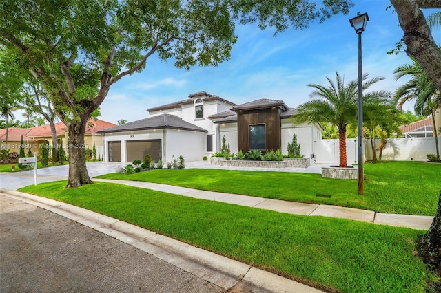 3461 SW 145th Ave, Miramar, FL 33027 - prairie-style house featuring an attached garage, driveway, and stucco siding