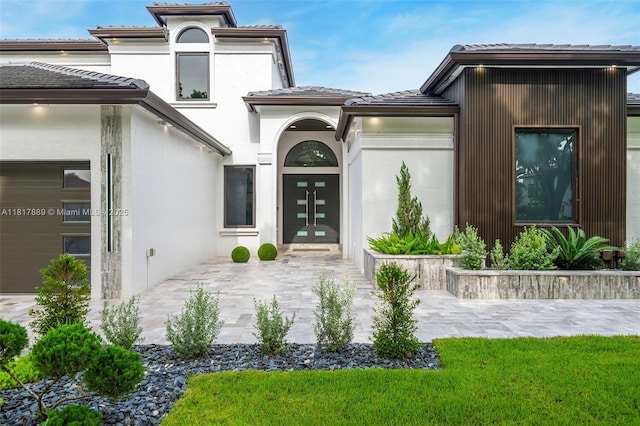 3461 SW 145th Ave, Miramar, FL 33027 - entrance to property with french doors, a tiled roof, and stucco siding