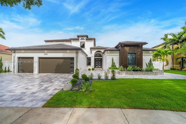 3461 SW 145th Ave, Miramar, FL 33027 - view of front of house with a garage, a front yard, decorative driveway, stucco siding, and a tile roof