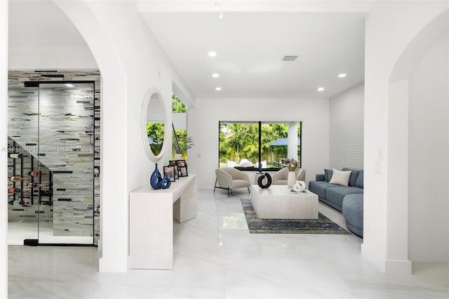 3461 SW 145th Ave, Miramar, FL 33027 - living room with arched walkways, marble tiled floors, recessed lighting, and baseboards