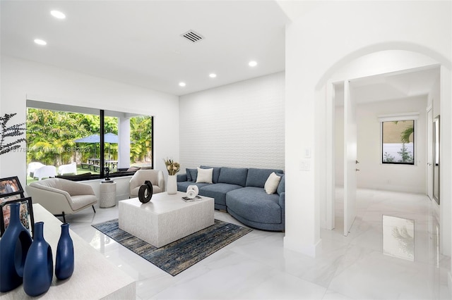 3461 SW 145th Ave, Miramar, FL 33027 - living room featuring recessed lighting, plenty of natural light, light marble finish floors, and baseboards