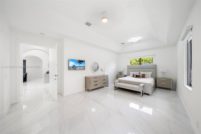 3461 SW 145th Ave, Miramar, FL 33027 - bedroom featuring a raised ceiling, arched walkways, and light marble finish floors