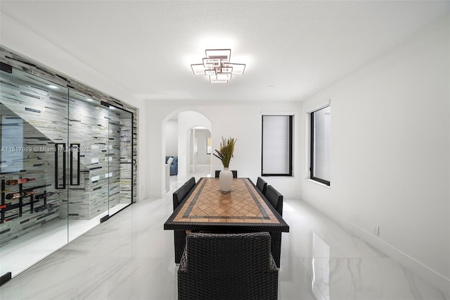 3461 SW 145th Ave, Miramar, FL 33027 - dining space featuring arched walkways and light marble finish flooring