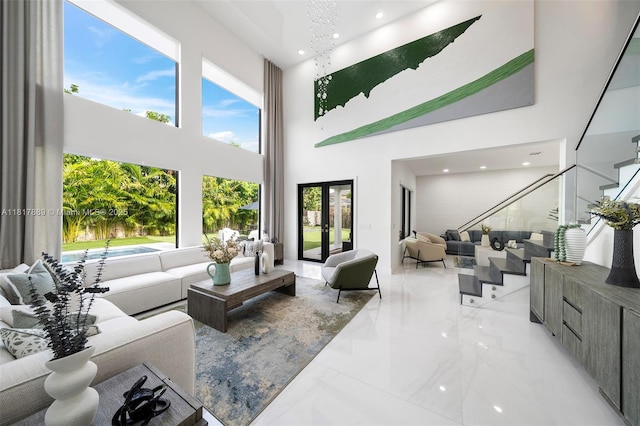 3461 SW 145th Ave, Miramar, FL 33027 - living area featuring a towering ceiling, stairs, light marble finish flooring, and recessed lighting