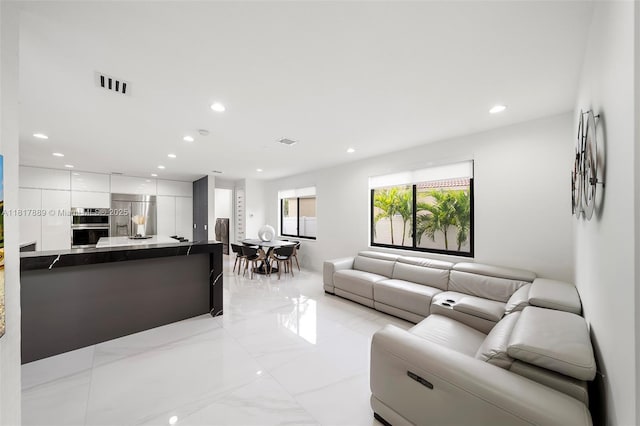 3461 SW 145th Ave, Miramar, FL 33027 - living room featuring recessed lighting and light marble finish flooring