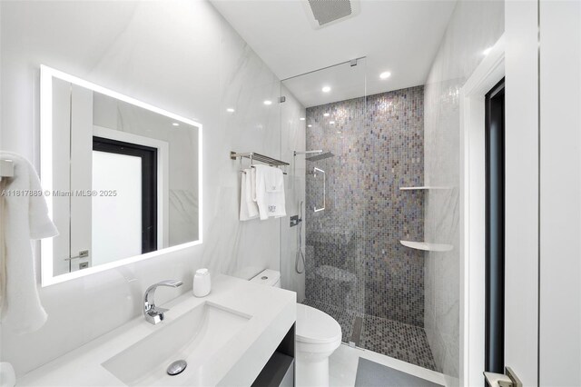 3461 SW 145th Ave, Miramar, FL 33027 - bathroom with toilet, vanity, a tile shower, and recessed lighting