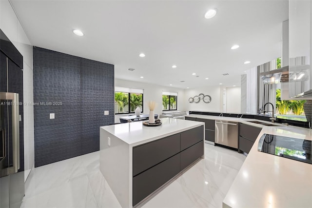 3461 SW 145th Ave, Miramar, FL 33027 - kitchen with modern cabinets, dishwasher, a sink, light marble finish flooring, and a center island