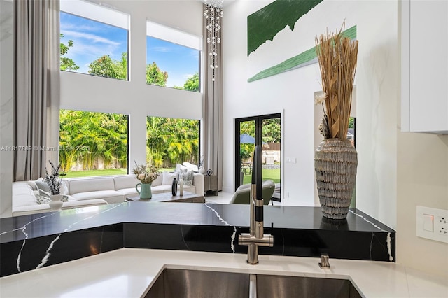 3461 SW 145th Ave, Miramar, FL 33027 - kitchen featuring a towering ceiling and white cabinetry