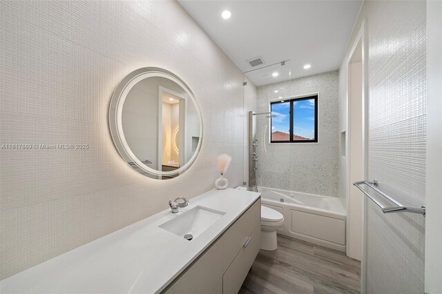 3461 SW 145th Ave, Miramar, FL 33027 - bathroom with toilet, vanity, wood finished floors, shower / washtub combination, and recessed lighting