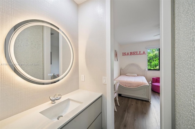 3461 SW 145th Ave, Miramar, FL 33027 - bathroom featuring wood finished floors, vanity, and ensuite bath