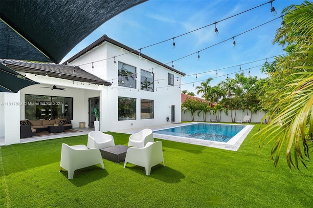 3461 SW 145th Ave, Miramar, FL 33027 - back of property featuring an outdoor hangout area, stucco siding, a yard, and a ceiling fan