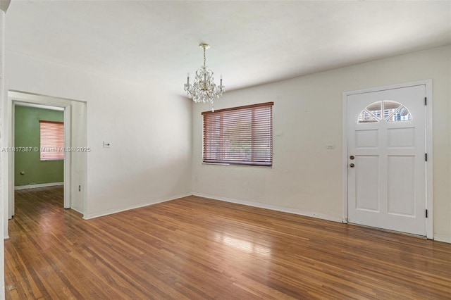 3241 SW 20th St, Miami, FL 33145 - entryway with a chandelier, wood finished floors, and baseboards