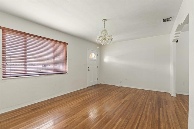3241 SW 20th St, Miami, FL 33145 - spare room with a chandelier, wood finished floors, and baseboards