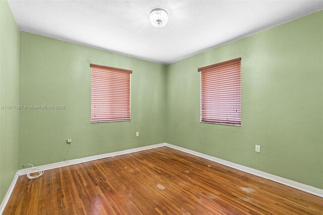 3241 SW 20th St, Miami, FL 33145 - empty room featuring hardwood / wood-style flooring and baseboards