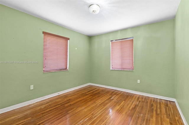 3241 SW 20th St, Miami, FL 33145 - spare room featuring baseboards and hardwood / wood-style flooring