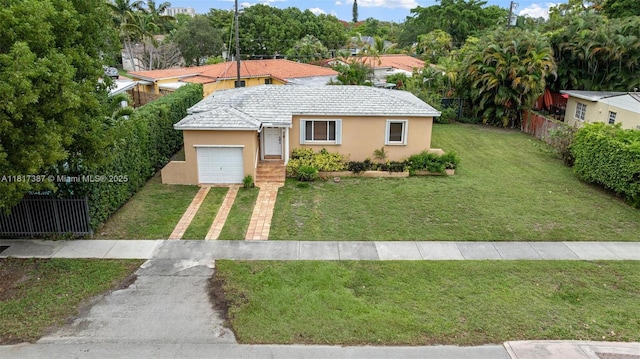 3241 SW 20th St, Miami, FL 33145 - view of front of home with driveway, stucco siding, and a garage