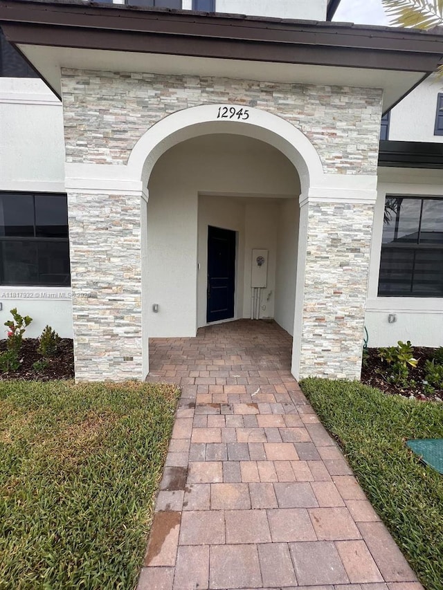 12945 SW 232nd Ln, Homestead, FL 33032 - entrance to property with stucco siding and stone siding