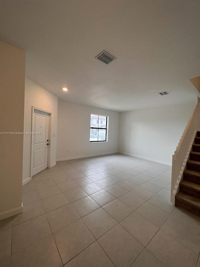 12945 SW 232nd Ln, Homestead, FL 33032 - unfurnished room with light tile patterned floors, recessed lighting, stairway, and baseboards