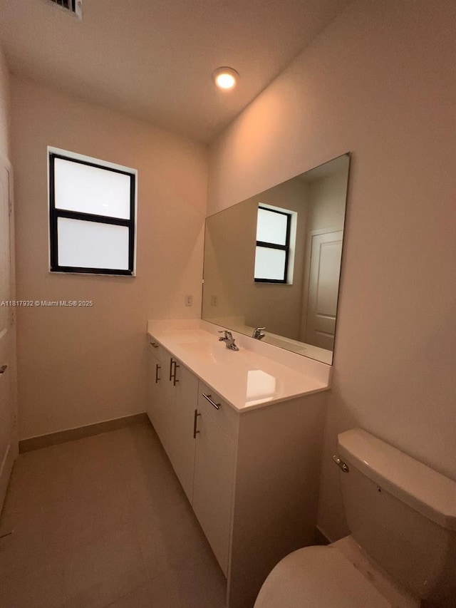 12945 SW 232nd Ln, Homestead, FL 33032 - bathroom with toilet, vanity, recessed lighting, and tile patterned flooring