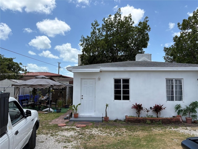 3072 SW 16th St, Miami, FL 33145 - view of front facade featuring stucco siding and roof with shingles