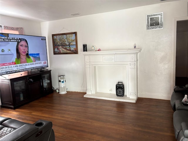 3072 SW 16th St, Miami, FL 33145 - living room featuring wood finished floors, baseboards, and a fireplace with raised hearth