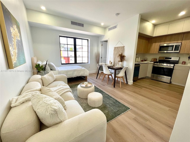 1619 Jefferson Ave Unit 23, Miami Beach, FL 33139 - living room with light wood-style flooring, recessed lighting, and baseboards