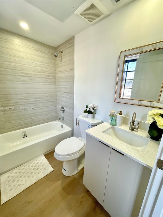 1619 Jefferson Ave Unit 23, Miami Beach, FL 33139 - bathroom featuring shower / bathtub combination, wood finished floors, toilet, and vanity