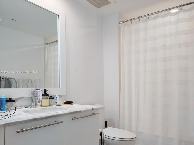950 Brickell Bay Dr Unit 1608, Miami, FL 33131 - bathroom featuring vanity and a shower with shower curtain