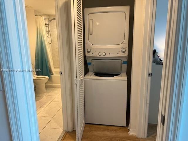 950 Brickell Bay Dr Unit 1608, Miami, FL 33131 - washroom featuring stacked washing machine and dryer